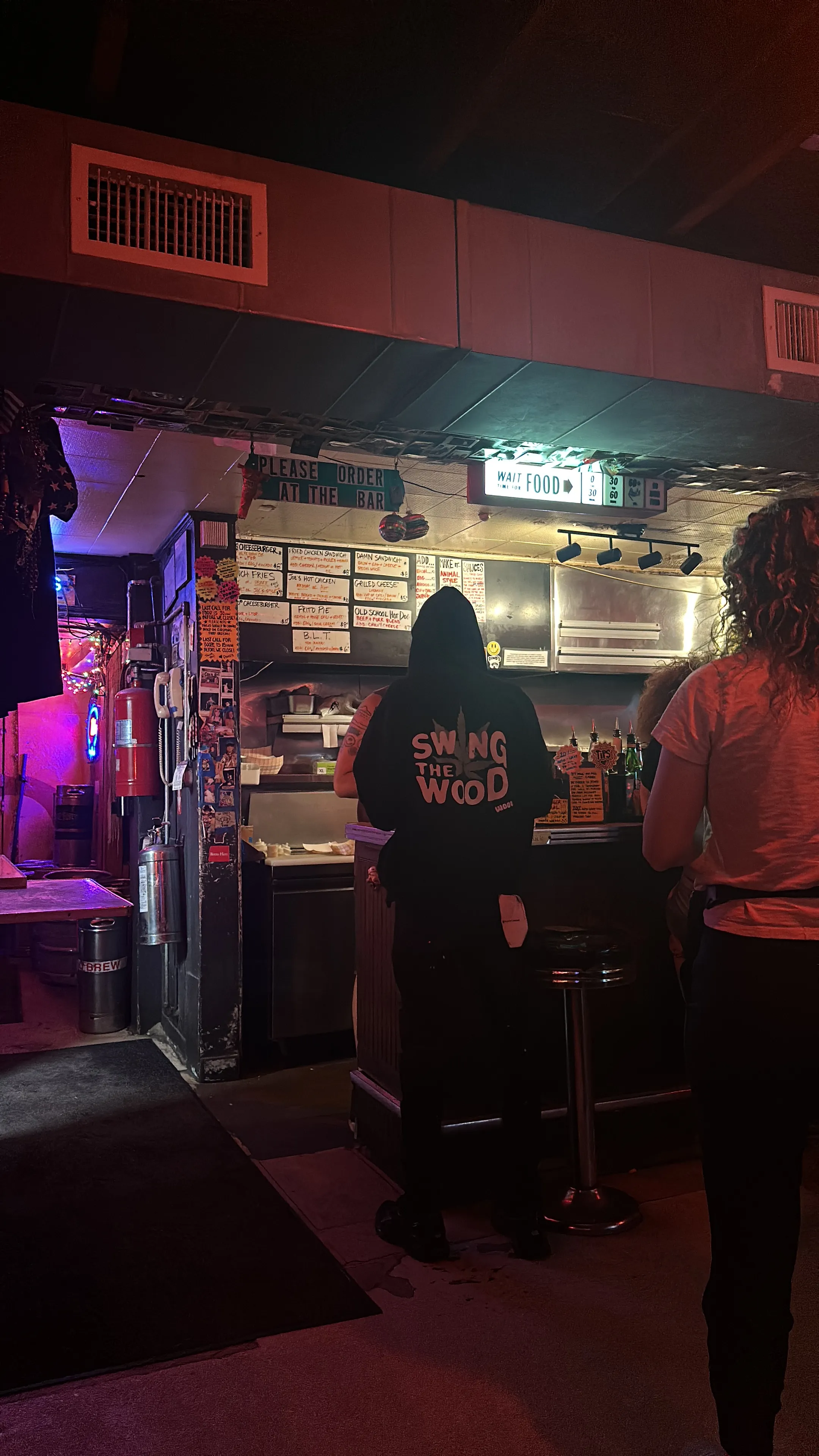 Inside Dino's, East Nashville's oldest dive bar, with its sticker-covered walls