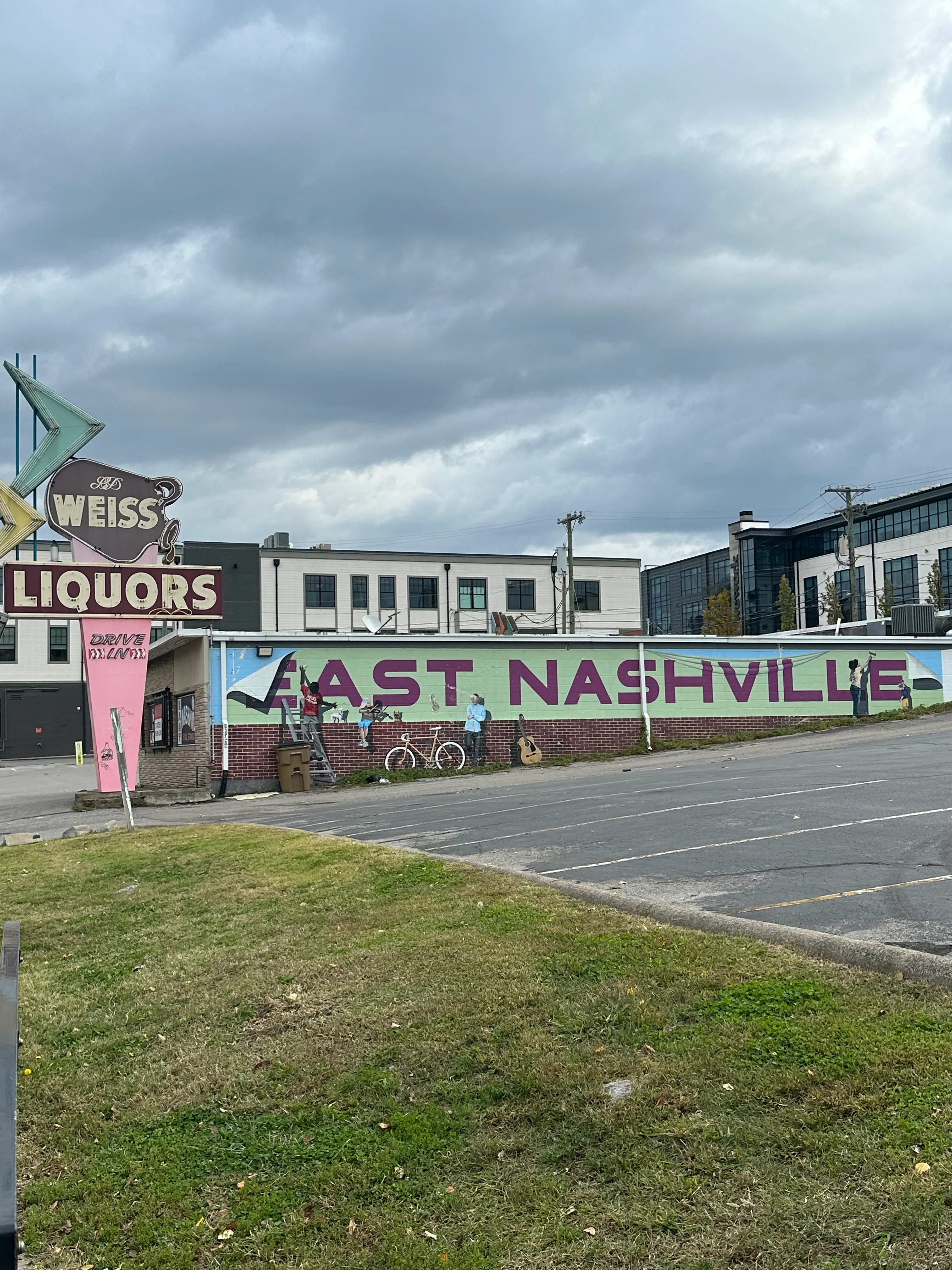 The One Little butterfly mural in East Nashville, with Carina walking past