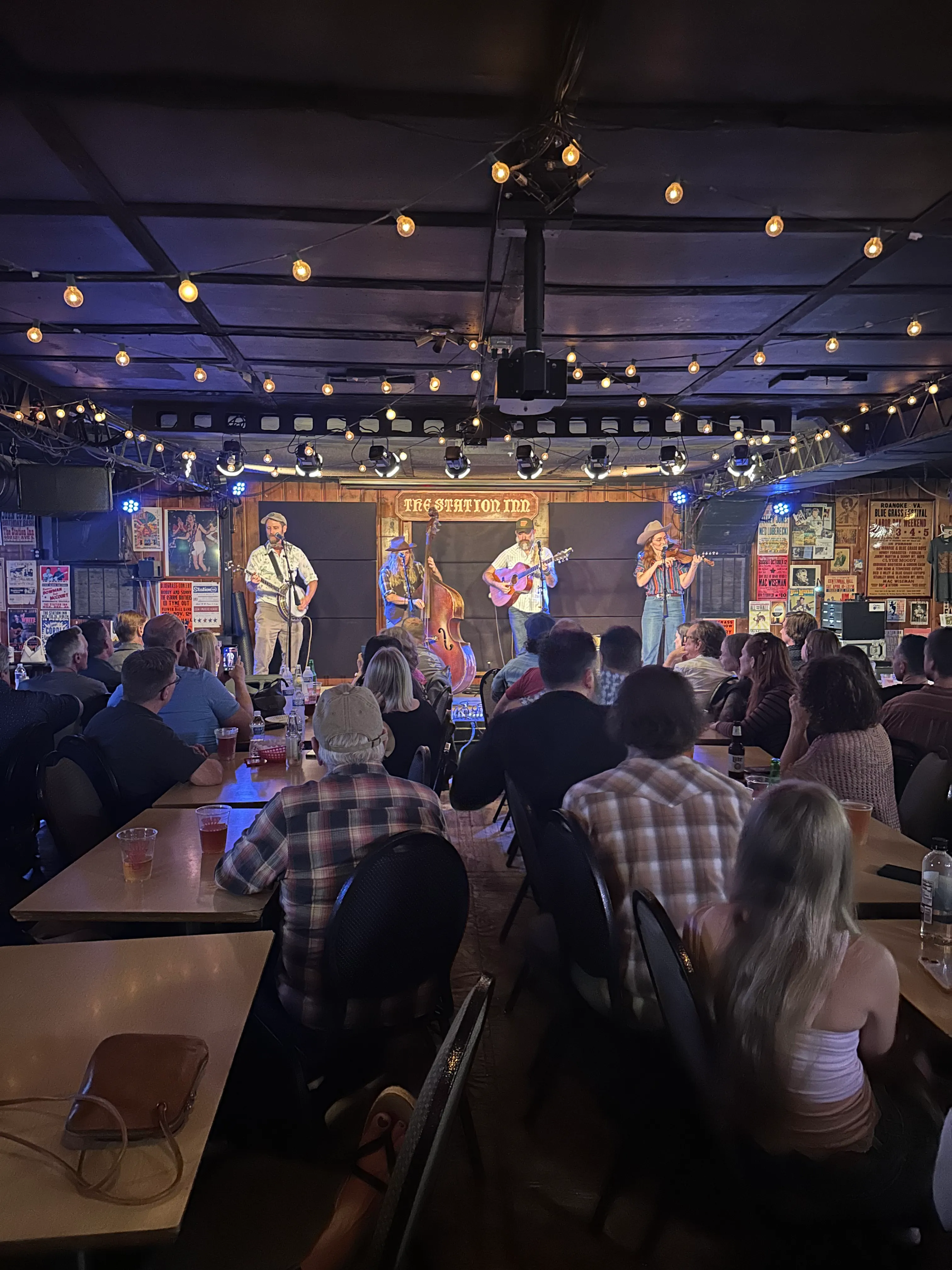The Station Inn interior with its Budweiser neon sign and bluegrass posters